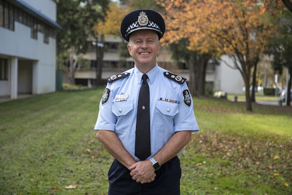 This is a photo of Deputy Commissioner Neil Gaughan APM – Chief Police Officer for the ACT at the front of the Winchester Police Centre.